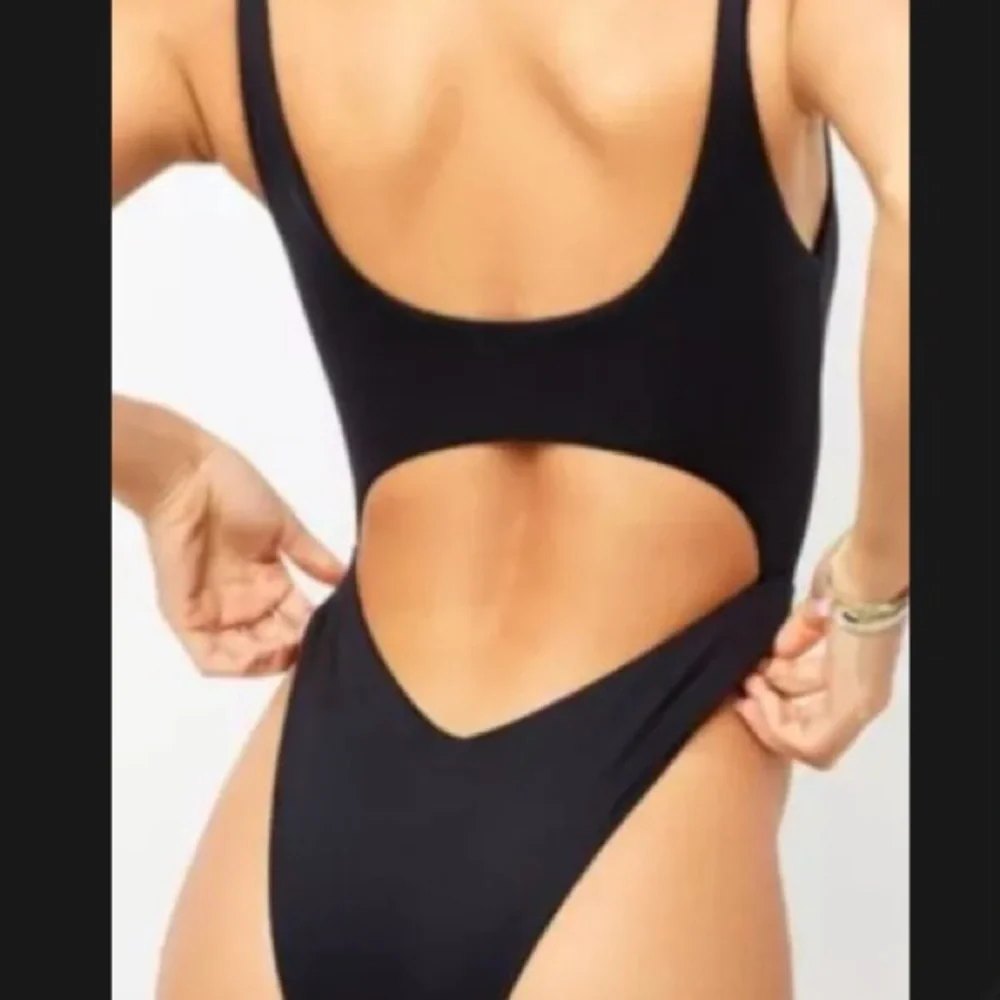 Frankie’s bikini sz medium. Monokini one piece w/cutouts. Adjustable coverage